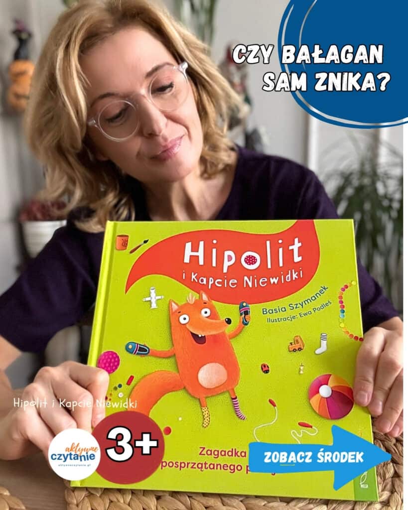 Kobieta w okularach trzyma żółto-zieloną okładkę książki „Hipolit i Kapcie Niewidki” Basi Szymanek z rudym lisem na okładce